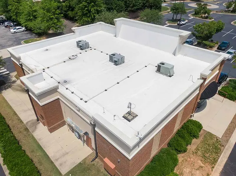 White coated flat roof on a commercial building, seen from above