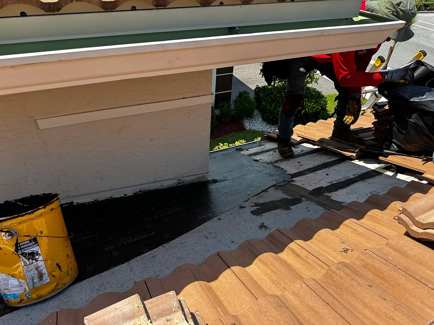 Old tile removed down to the roof deck during a roof replacement in Florida